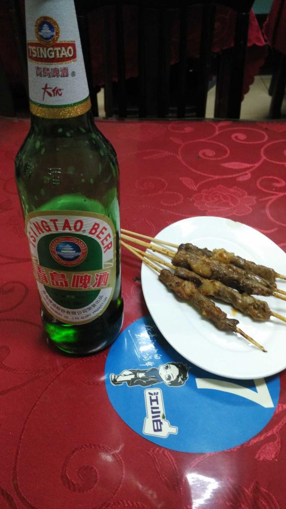 7 yuan for the beer, 3 yuan each for the chuar. They’re traditionally mutton, with cubes of fat strategically placed on the skewer which crisp and render.