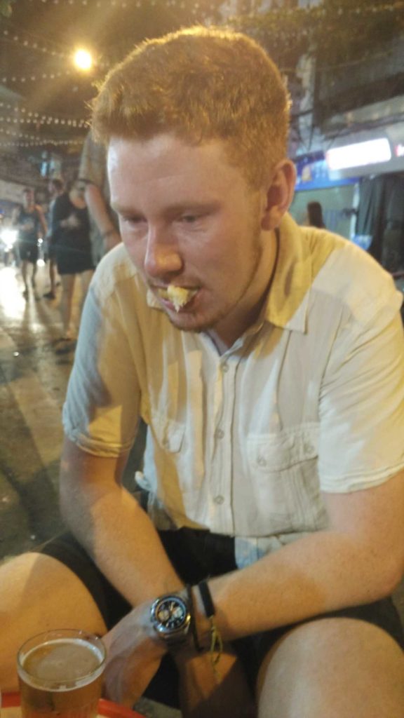 George, in all his disappointment, right after trying an underwhelming fried doughnut