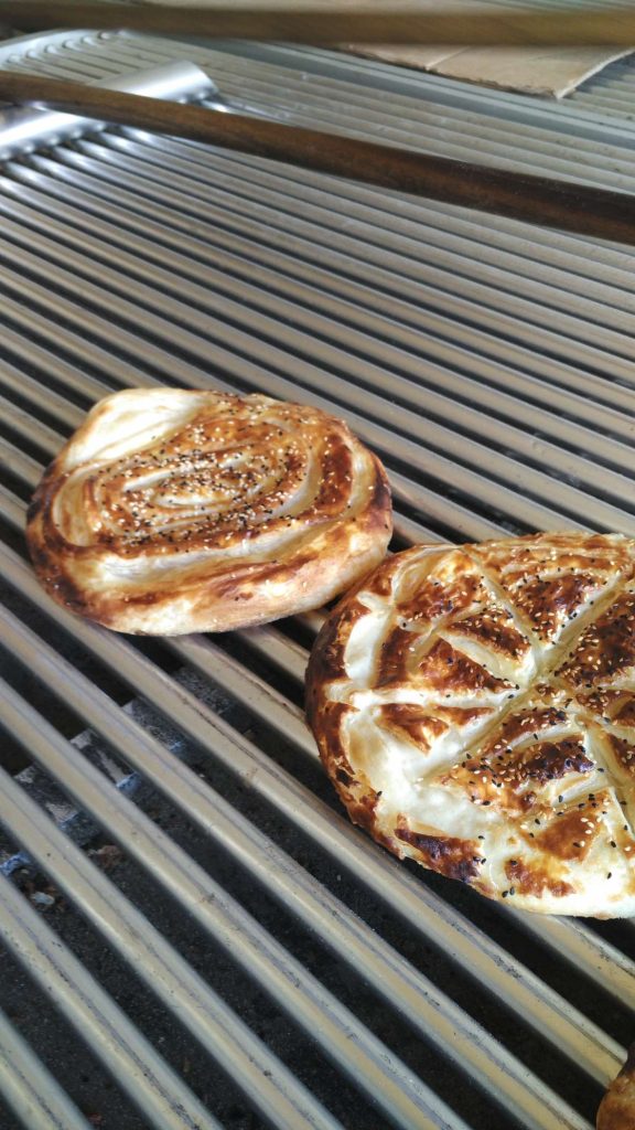 Fresh out of the oven, still bubbling. Topped with toasted sesame seeds