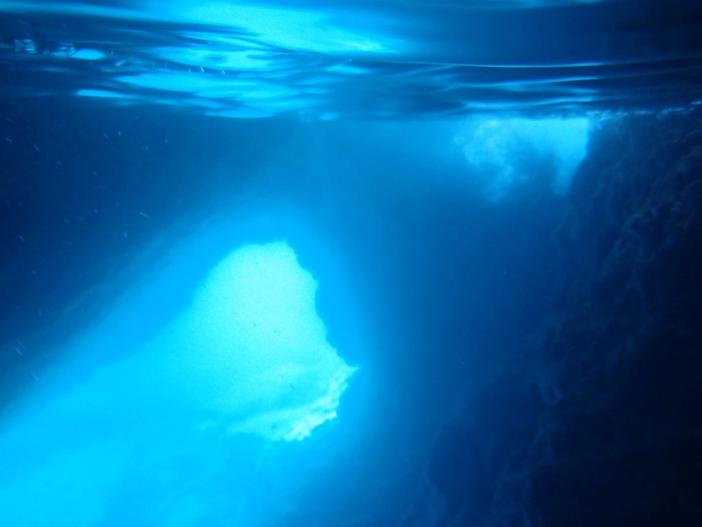 The tunnel, with blue light streaming through. It gave the water inside the cave a ghostly glow