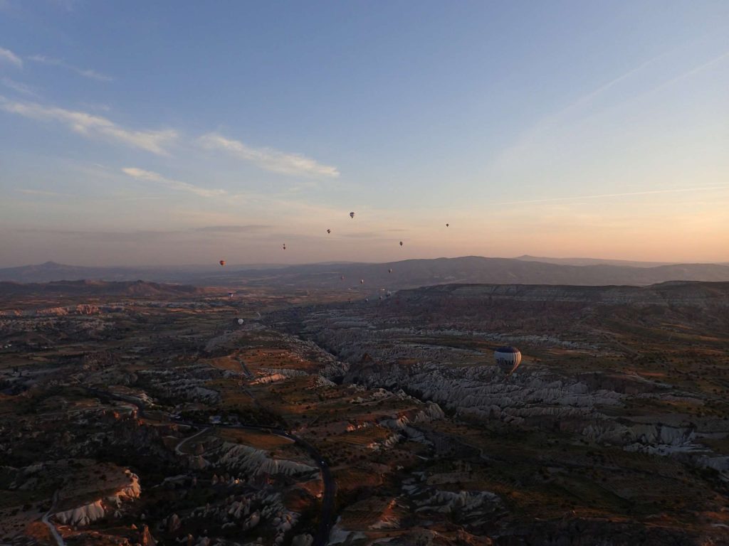 The sun gradually illuminates the Cappadocian moonscape