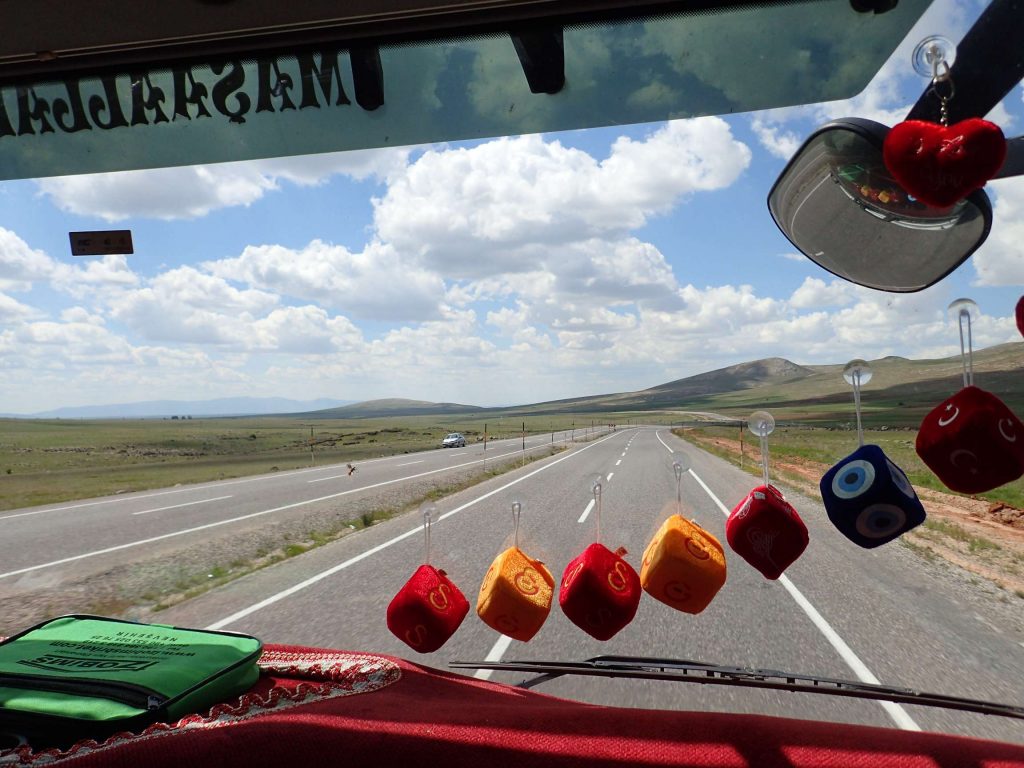 The interior of Gökhan’s truck. He had a large gearstick which would click and whirr as he lazily accelerated and decelerated. He could often be found with a foot on the steering wheel, his seat, or even out the window. Cruise control was used liberally.