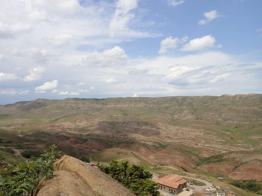 These hills looked like layered gemstones studded in the hillside, polished to reveal the layers of colour