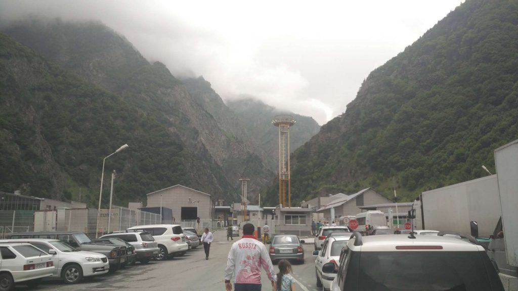 The Georgian border, featuring a man fittingly dressed in a Russia jacket.