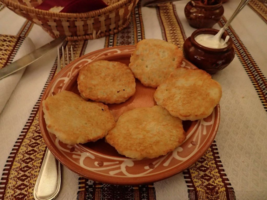 Fried mashed potato with sour cream