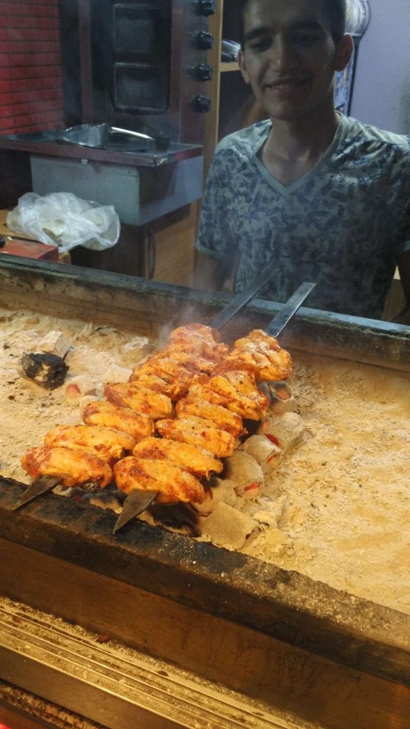 Cooking meat, the smell wafting out into the street…